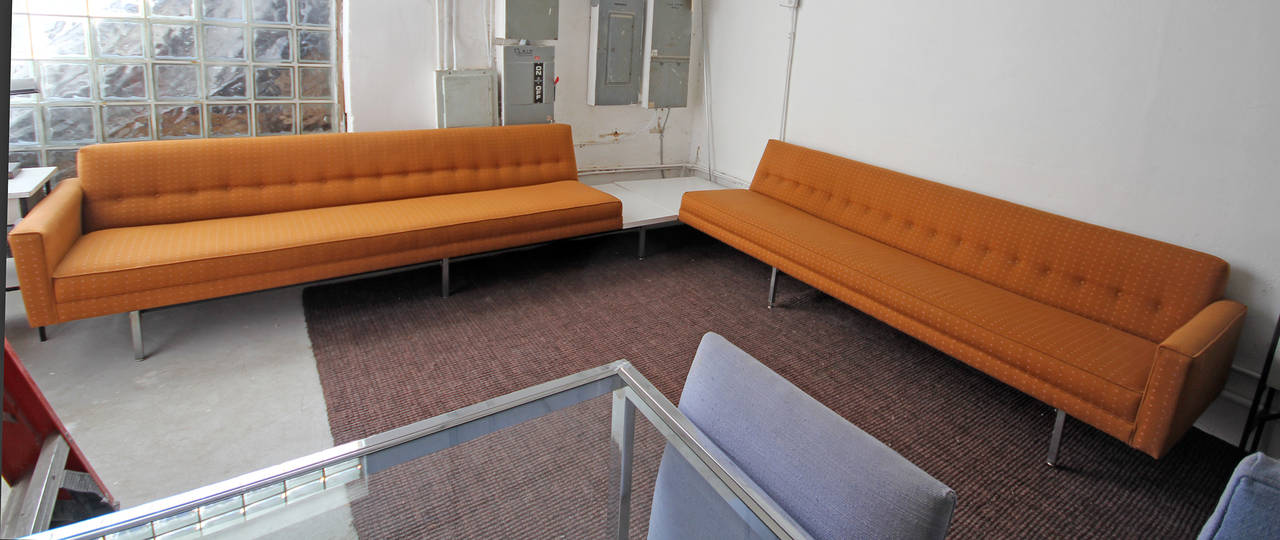 A stunning, iconic piece of Mid-Century Modern design, a George Nelson for Herman Miller sectional sofa! The sofa is in fantastic condition with original orange fabric and attached side tables with white laminate tops.

One piece measures: 124