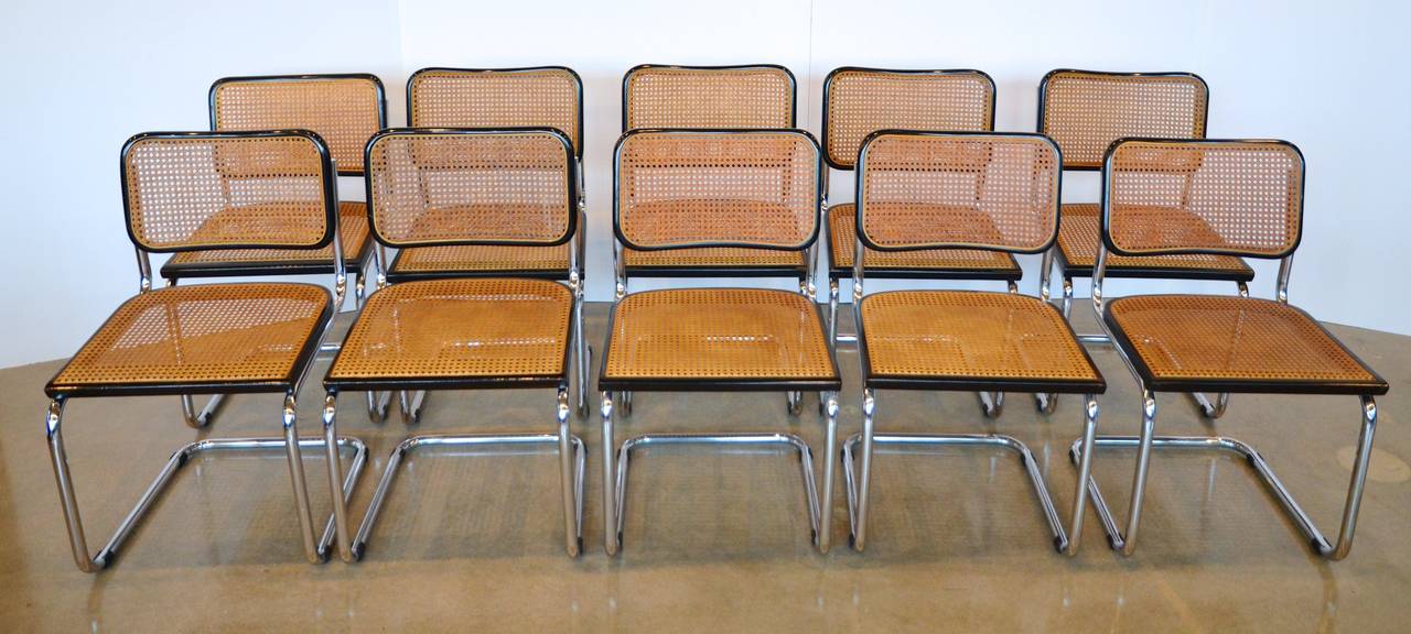 Post-war modern 'Cesca' chairs, c. 1925 design by Marcel Breuer (Hungarian/American, 1902-1981) for Knoll.  AKA the B32 Chair.  Sophisticated ebonized wood with cane back and seat set on tubular chromed steel frame.  They work beautifully as a set