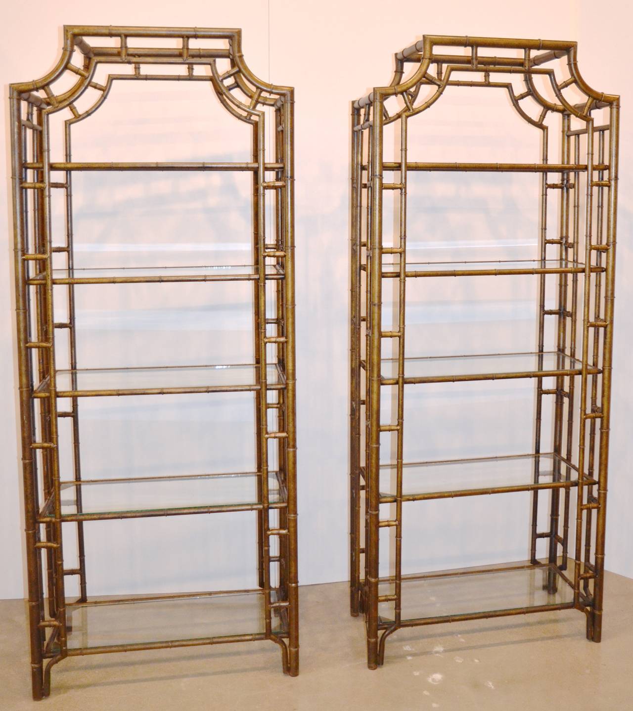 Sculptural étagères with glass shelves and brass or bronze finish.  2 Available, now sold separately.