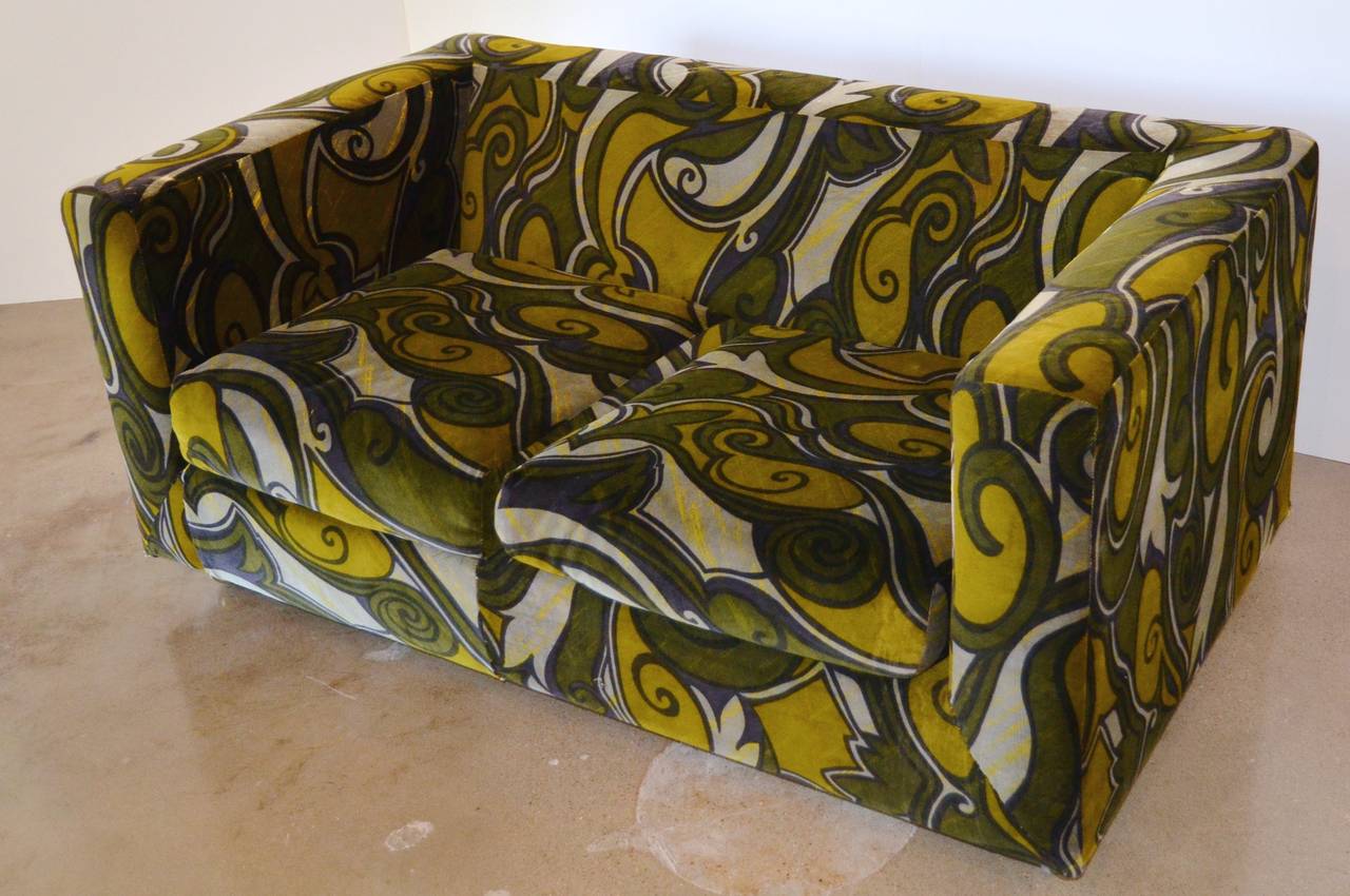 Love, love, love Jack Lenor Larsen's loveseat for Dunbar. He is the textile master of glam. Great color and form. Tight back with two loose seat cushions and brass casters. Dunbar name in fabric under cushion.