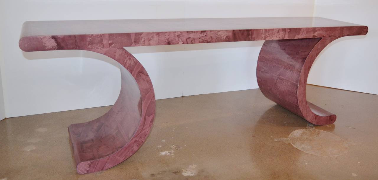 Great curves! Console table with original faux goatskin finish in rose-wine color. Classic Springer styling. Colors include pink, purple and burgundy.