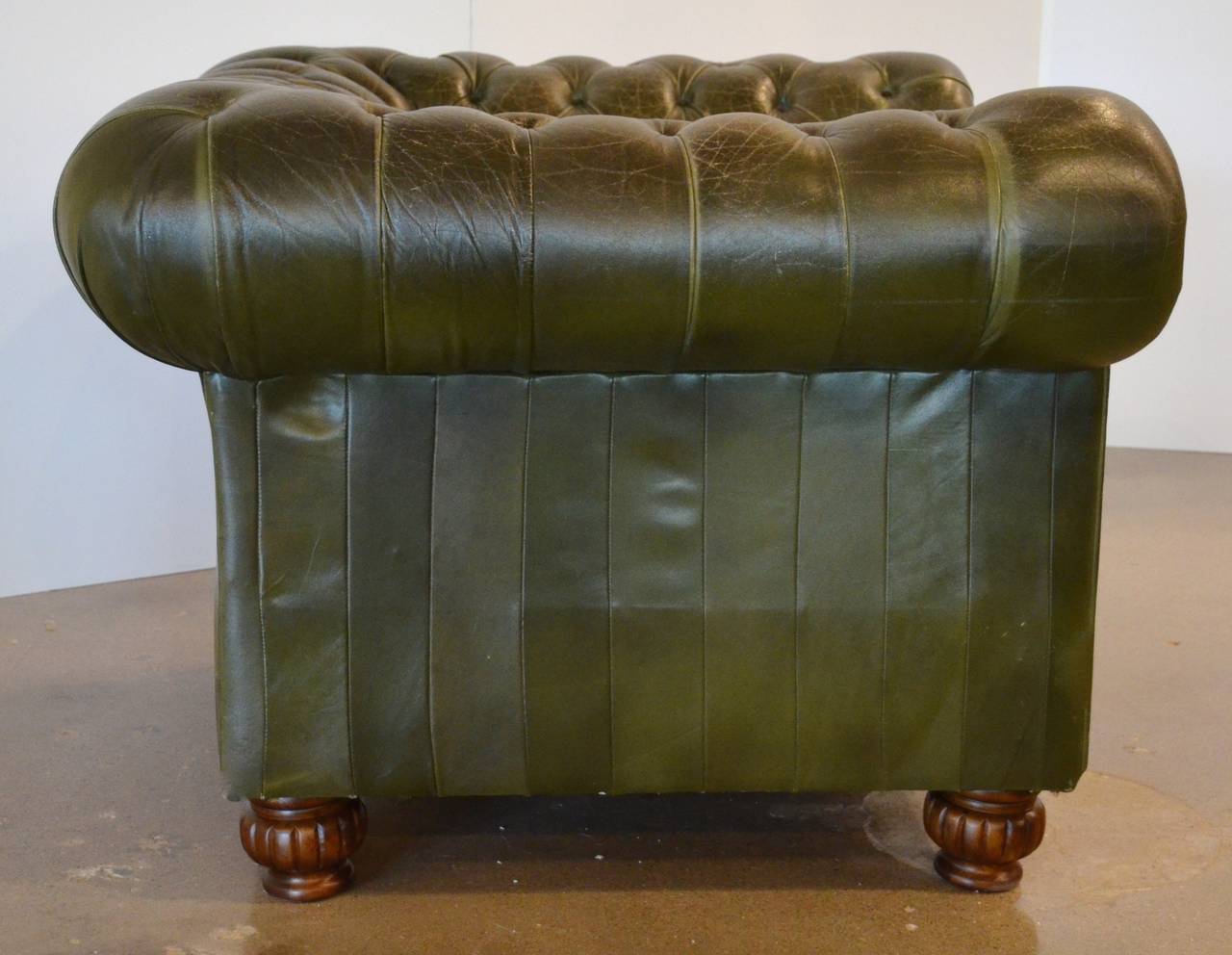 Vintage leather Chesterfield with beautiful color and patina. Leather shows just the right amount of age to bring character and sophistication to any setting.  This is one of a pair, see item LU114022145322 for second chair.