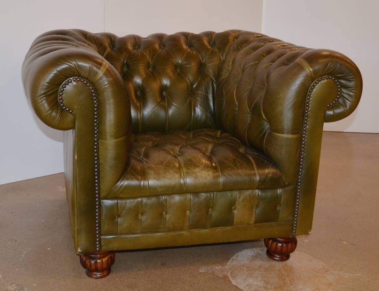 Vintage leather Chesterfield with beautiful color and patina. Tufted leather shows just the right amount of age to bring character and sophistication to any setting. Pair available.  See item LU114022145372 for second chair.