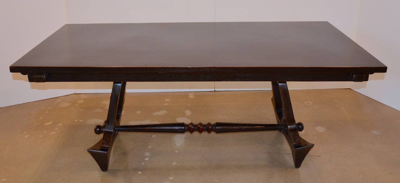 Sculptural trestle table and six chairs with unique detail and craftsmanship.  Stylized carving and woven rush seats and backs.  Likely crafted in Eastern Europe, but inspired by the French designer Andre' Sornay.
Chair dimensions 18.13
