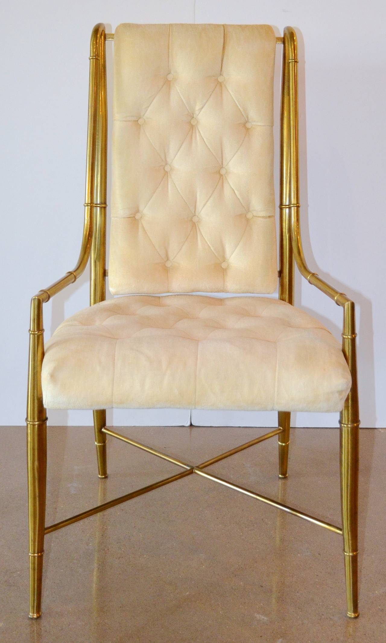 Highly sought after set of eight glamorous chairs from one of America's finest furniture makers. Classically styled heavy brass frames have been cleaned, but the desirable patina has been retained. Original upholstery is ready to be customized.