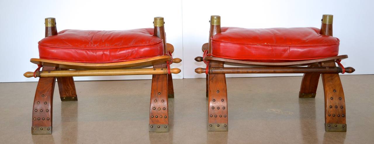 20th Century Camel Saddle Stools or Ottomans in Red Leather
