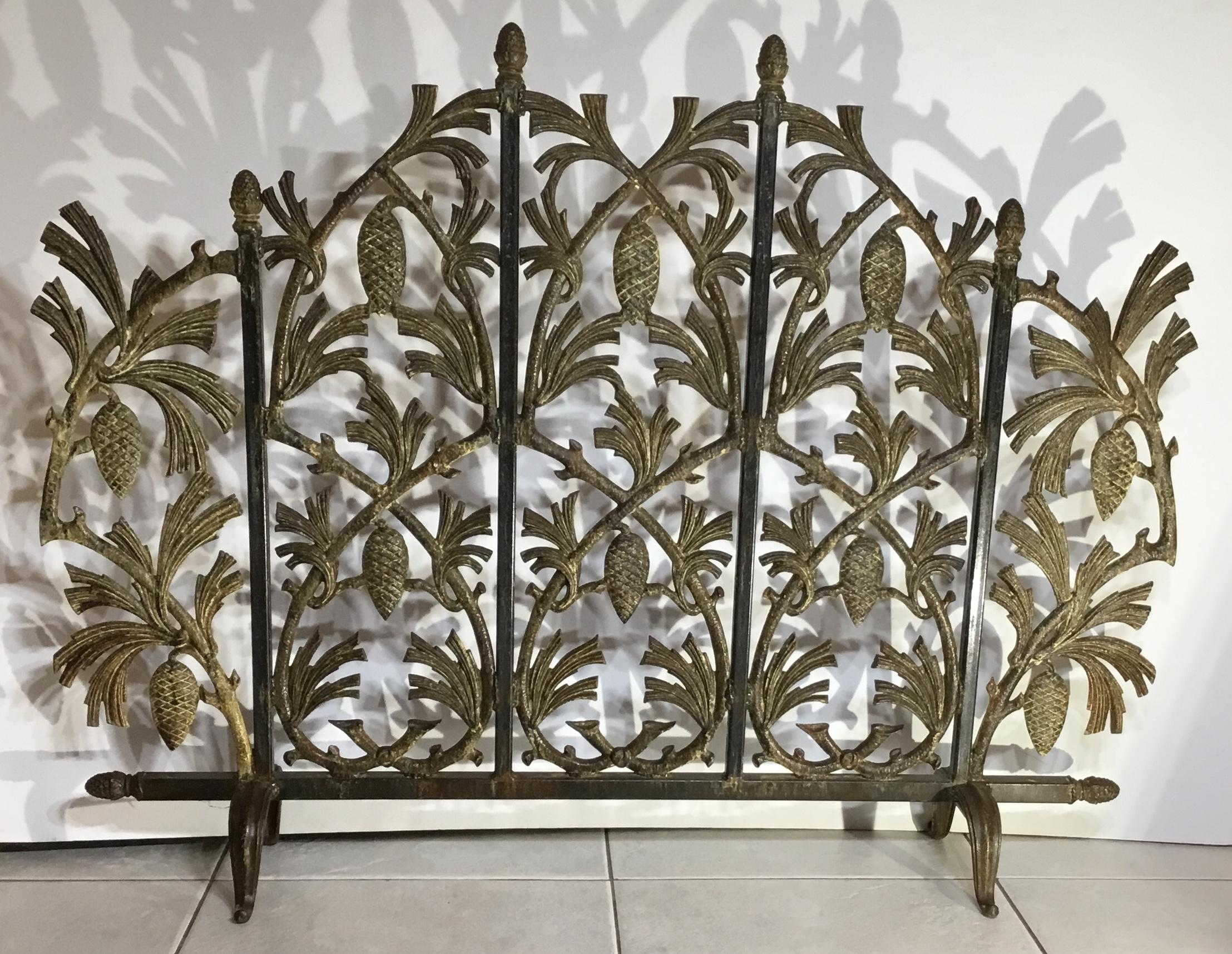 Exceptional fireplace screen made of cast iron with vines and pinecone motifs all around, beautiful patina, treated for rust, great decorative object of art for the fireplace.