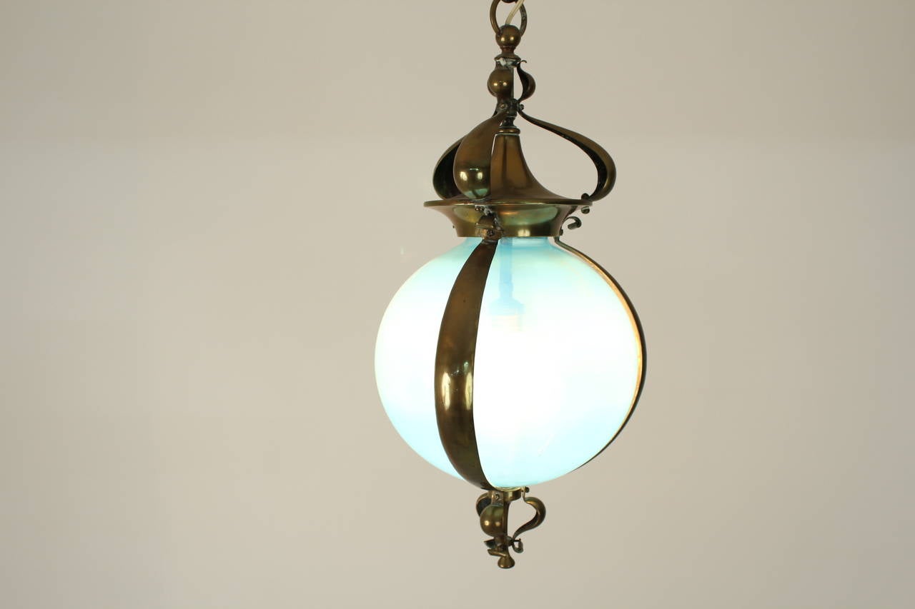 Stunning Art Nouveau hall lamp with original blue glass.
Brass frame.
In good condition.