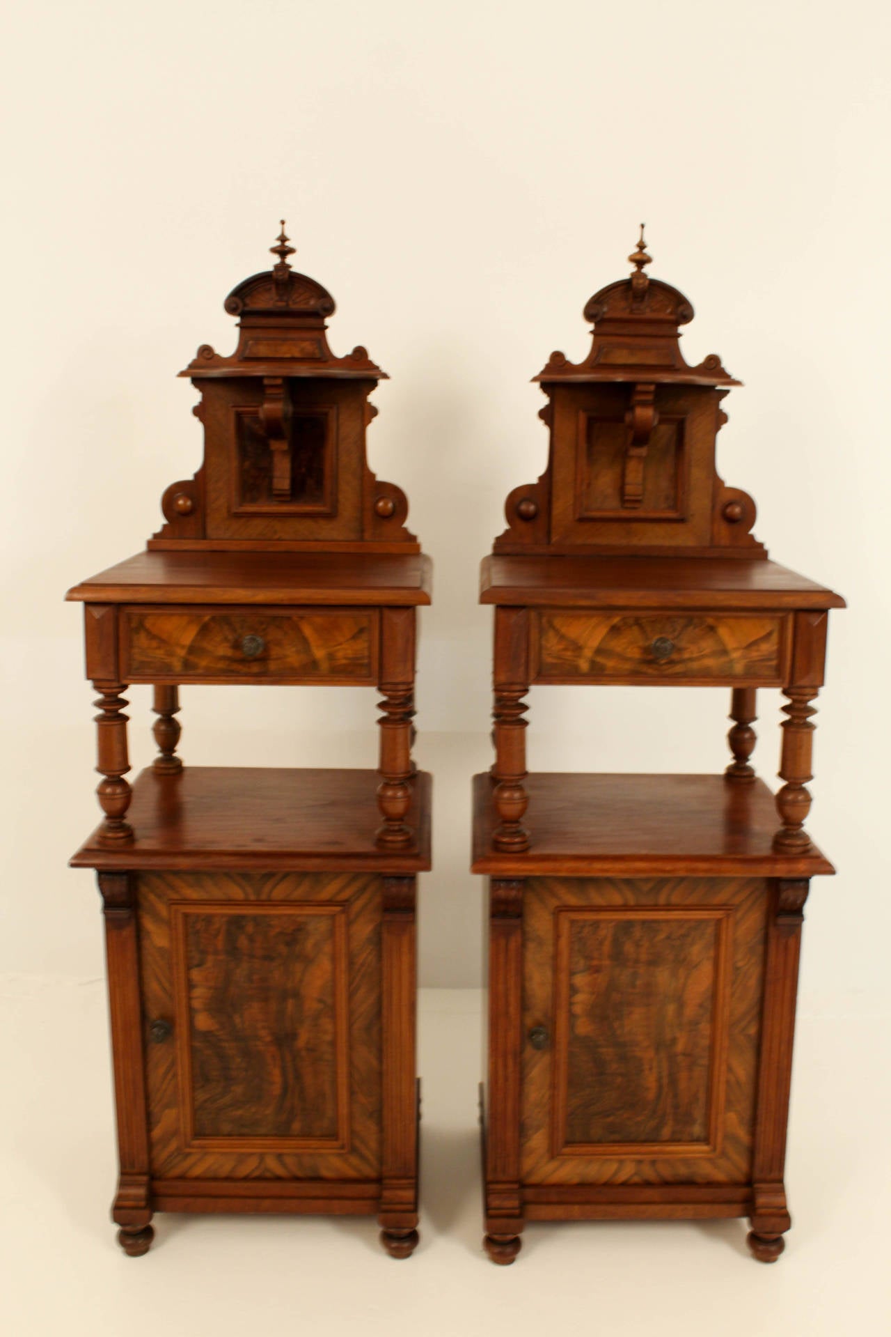 Beautiful pair of walnut Victorian nightstands with original brass knobs on drawers and doors.
In good original condition with minor wear consistent with age and use,preserving a beautiful patina.