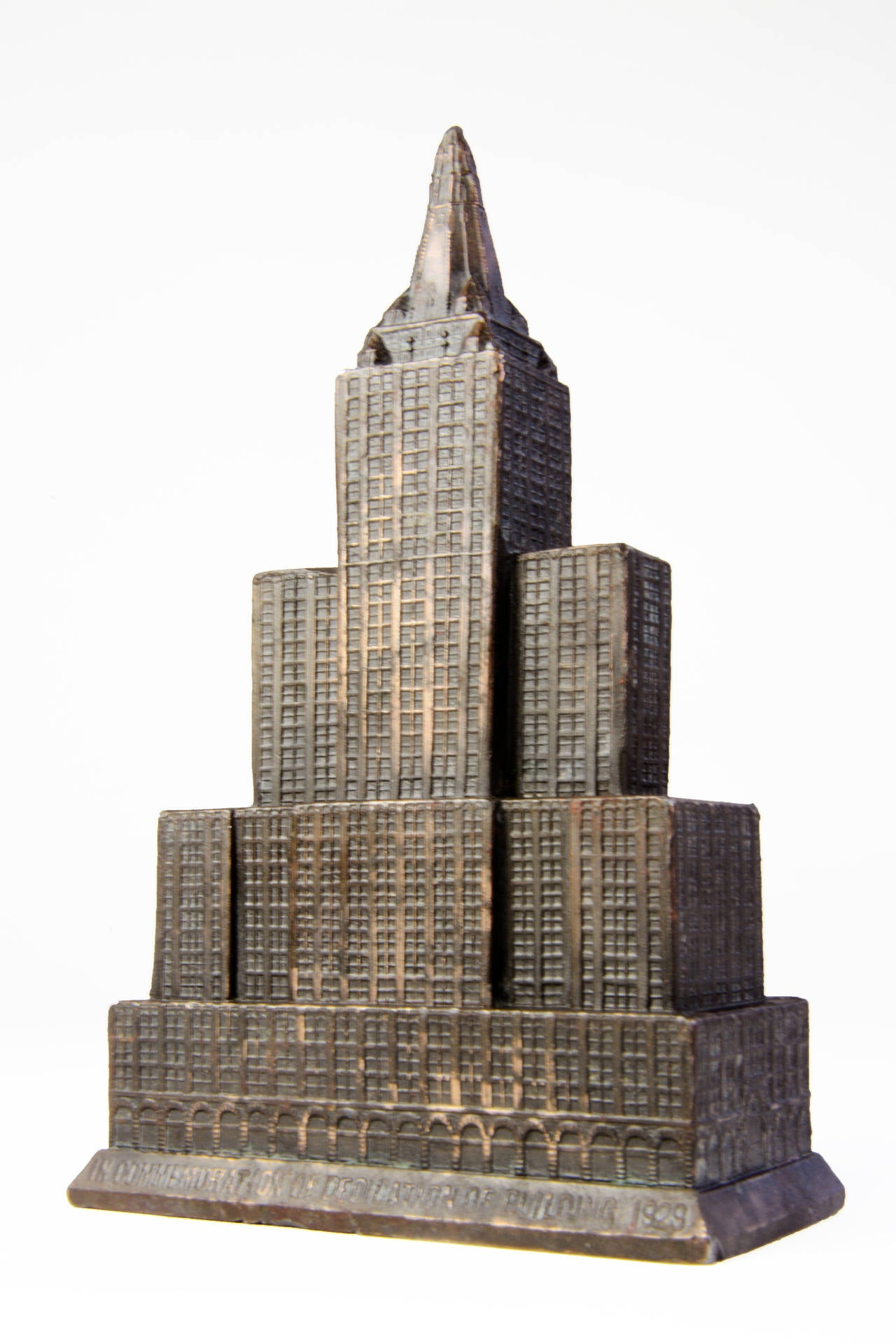 Among the most unusual souvenir building miniatures are those made to commemorate the opening of a new structure. Cast into the base of this well-detailed, copper-plated lead replica of the New York Life Insurance skyscraper, located across from