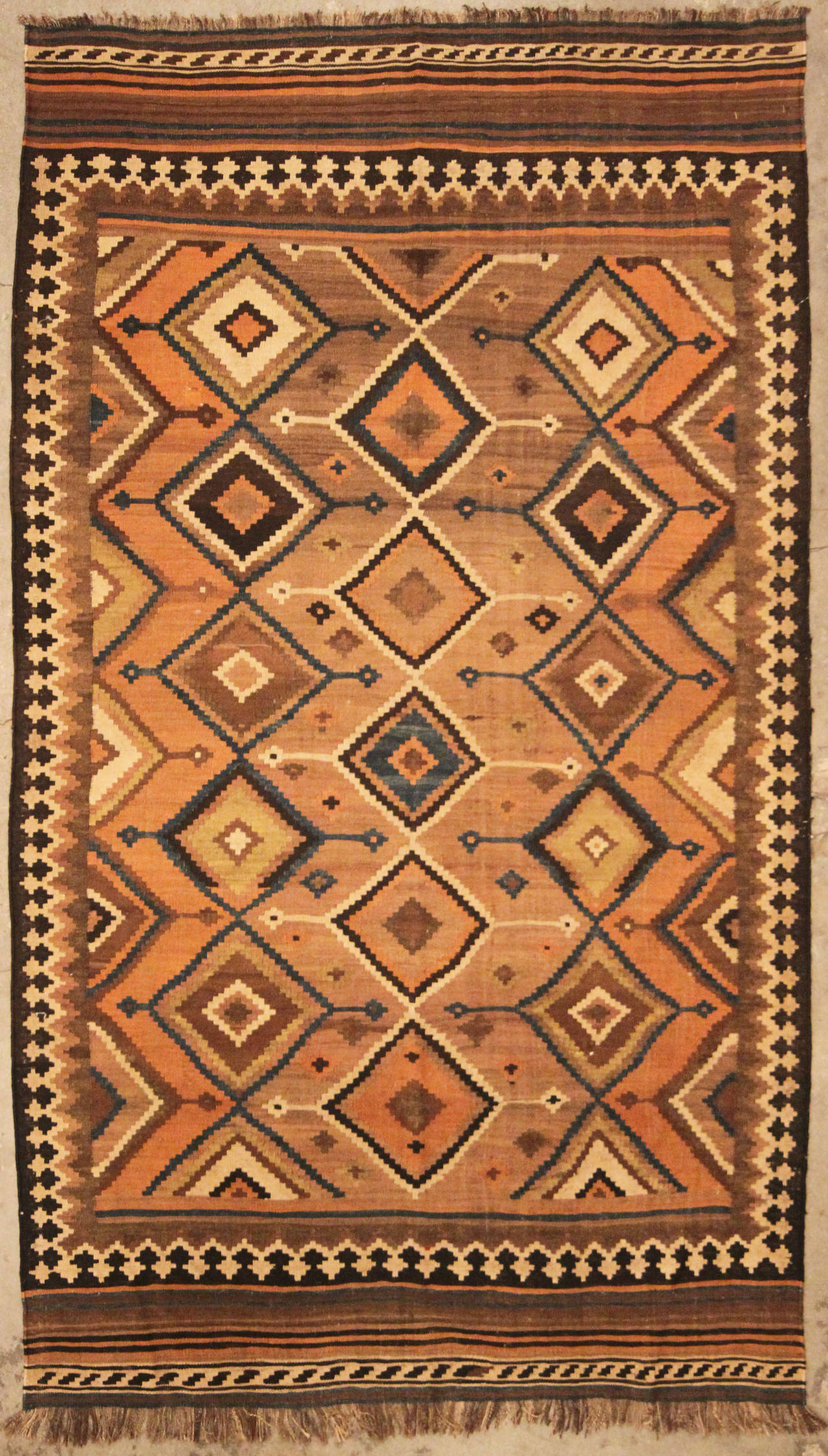 Colorful and dramatic Kilims (kelims) were produced by both villagers and tribal nomads in Persia. Slit tapestry predominated among Azerbaijani, Shahsevan and Qashqa'i weavers, while some Kurds and others in western Persia used interlocked tapestry.