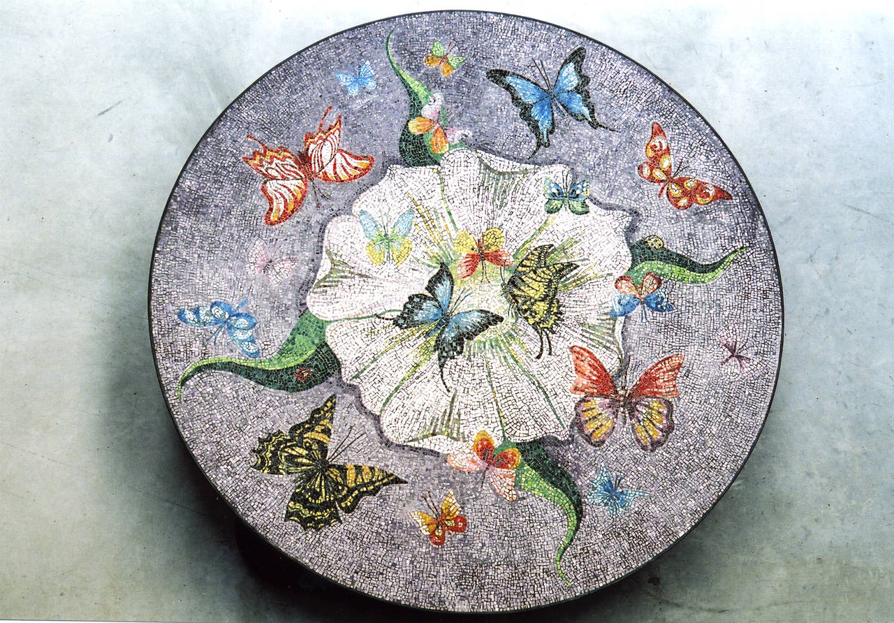 Flowers, fantasy and a delightful Surrealist approach imbue Grillo Demo's playful and colorful creations which span the fine art, decorative arts and furniture realms. His 'Almond Blossom' table - topped with exquisite mosaic of butterflies and a