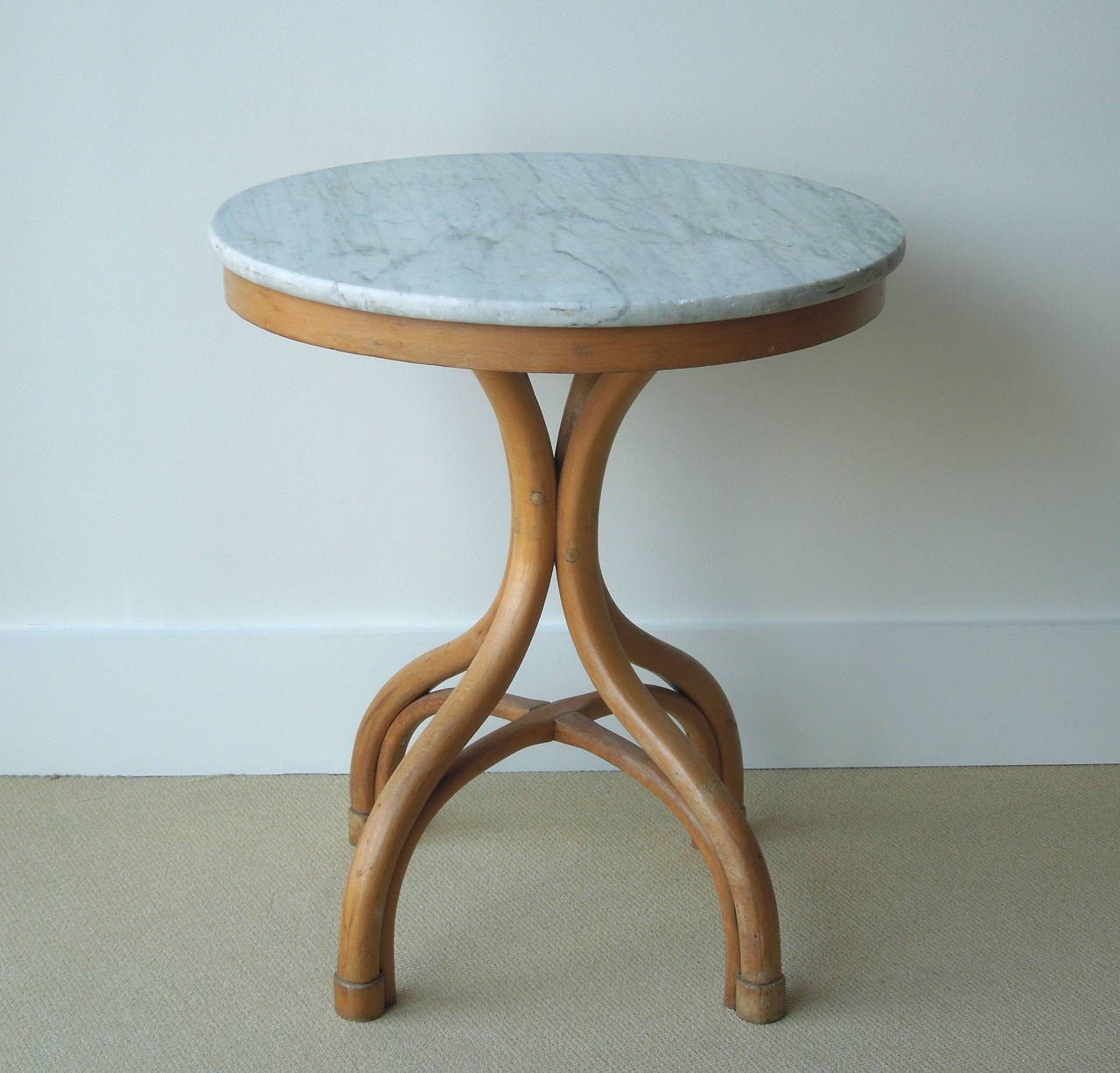 Thonet bentwood round center or cafe table with Carrara marble top and shaped legs with stretcher bars.