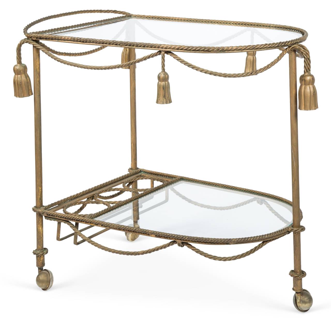 Hollywood Regency style gilt metal bar or tea serving cart featuring a tassel and rope design with two removable clear glass inserts and casters.