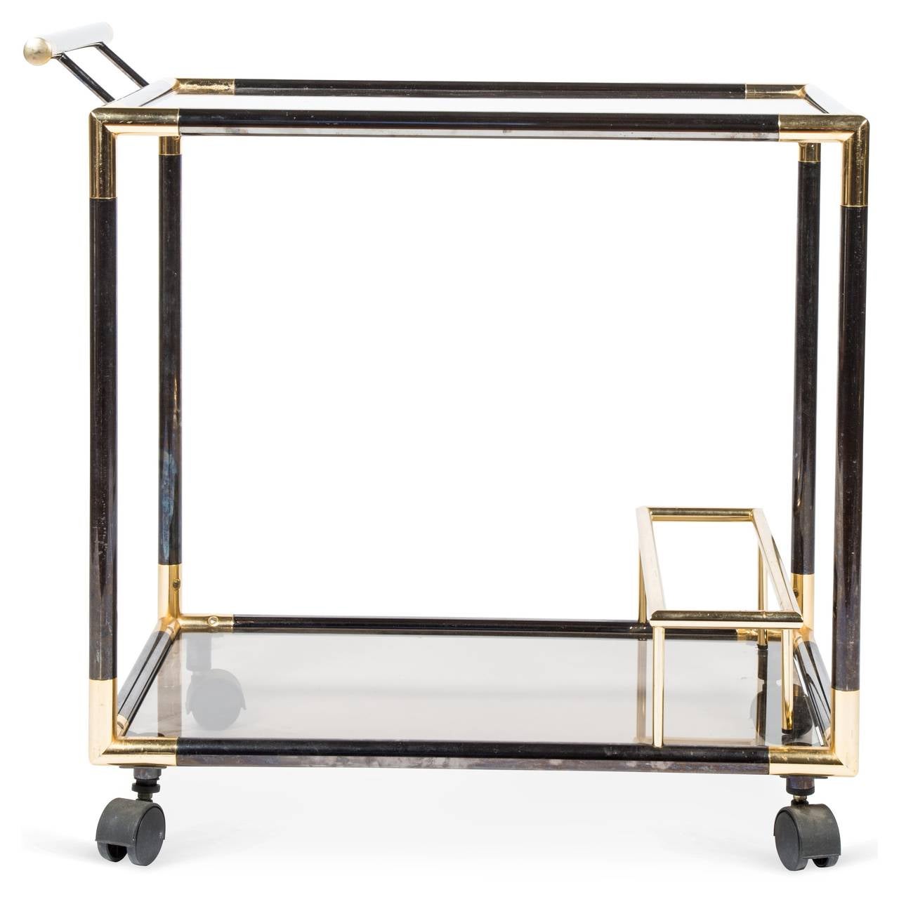 Mid Century Italian tubular tea/bar serving cart featuring a smoked metal frame with brass details.  Two removable smoked glass inserts, bottle holder, and casters.