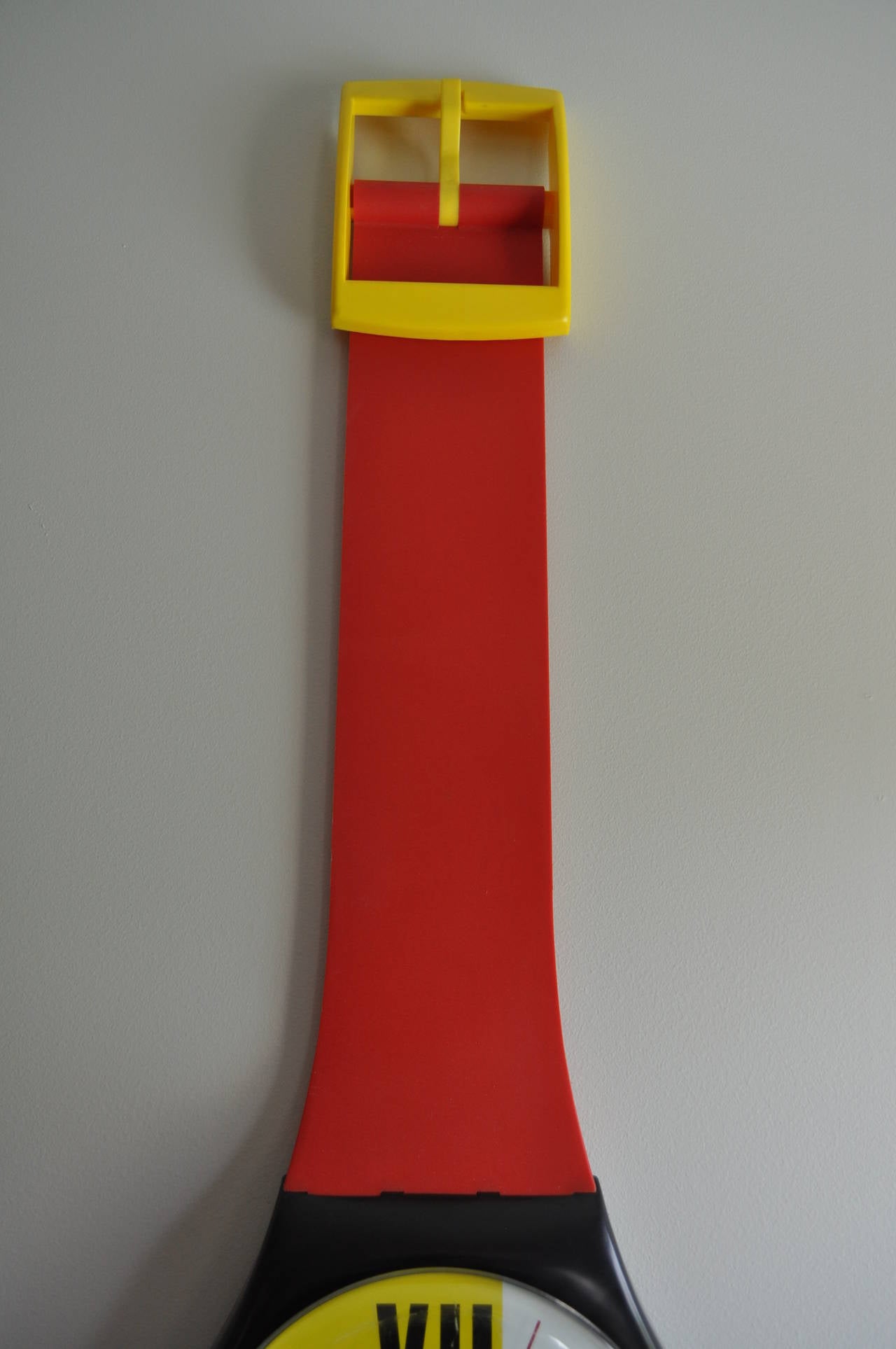 Iconic 1980's Swatch Watch Pop Art Wall Clock.  This wall mounted sculptural piece features bright and bold Memphis style primary red, blue, yellow, black and white colors.  Can be displayed with or without the included original plastic case.  Made