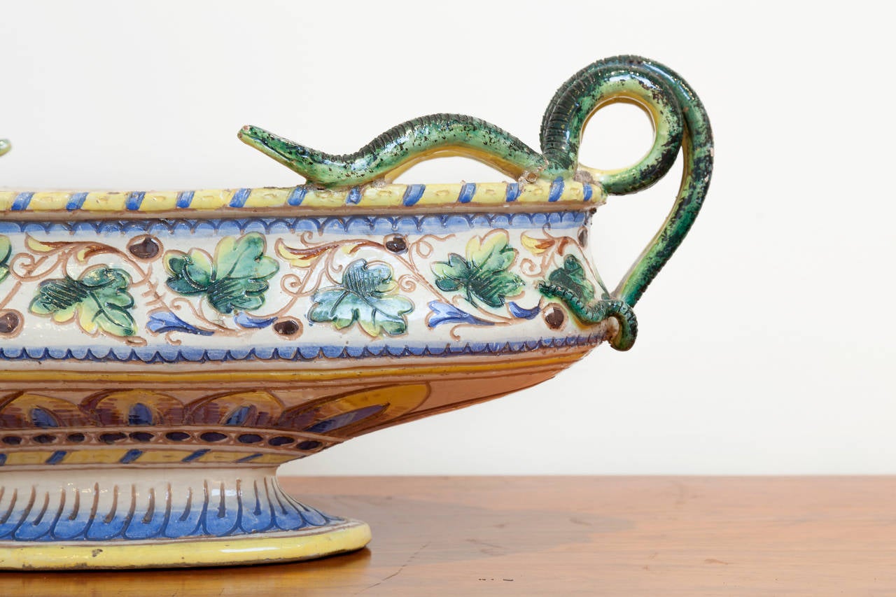 Majolica Oval Footed Bowl, circa 1920's, Italy. Beautiful Serpentine handles and intricate incised glaze pattern. Marked Italy on base. Width measurement includes handles.