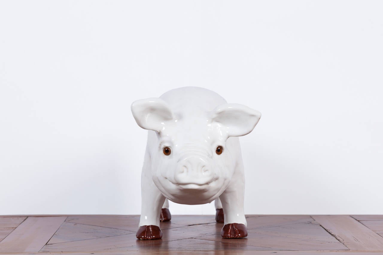 Charming white glazed figural ceramic Pig, France c. 1940's. Finely detailed with glass eyes.