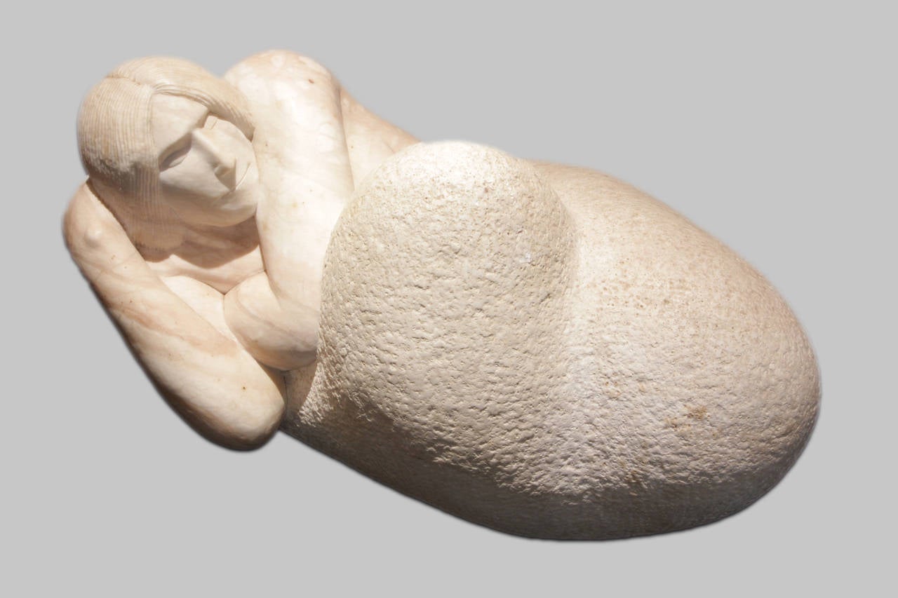 Native alabaster from the Jemez Mountains of Northern New Mexico, this sculpture is by controversial Chiricahua Apache artist Bob Haozous, c. 1980. While perhaps best known for his monumental steel sculptures, this piece depicting a reclining female