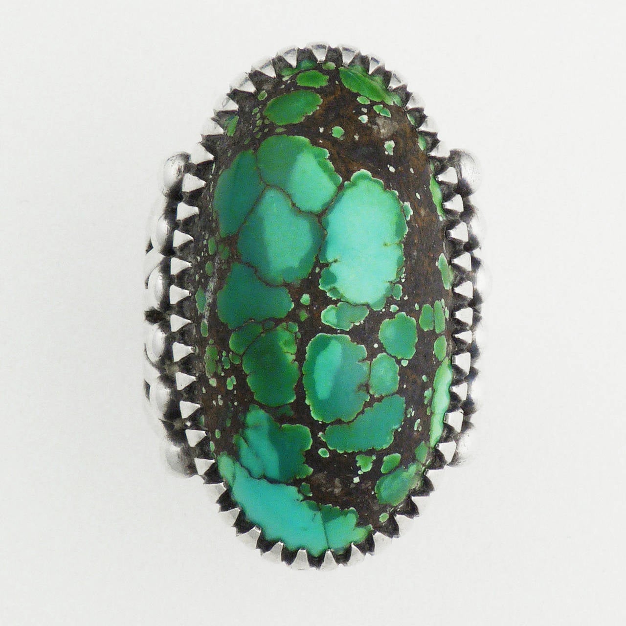 A stunning turquoise cocktail ring by famed Italian jeweler Frank Patania. Frank Patania Sr. (1899-1964) was born in Sicily and relocated to the United States, thus being highly influenced by Native American jewelers as early as 1920. He began