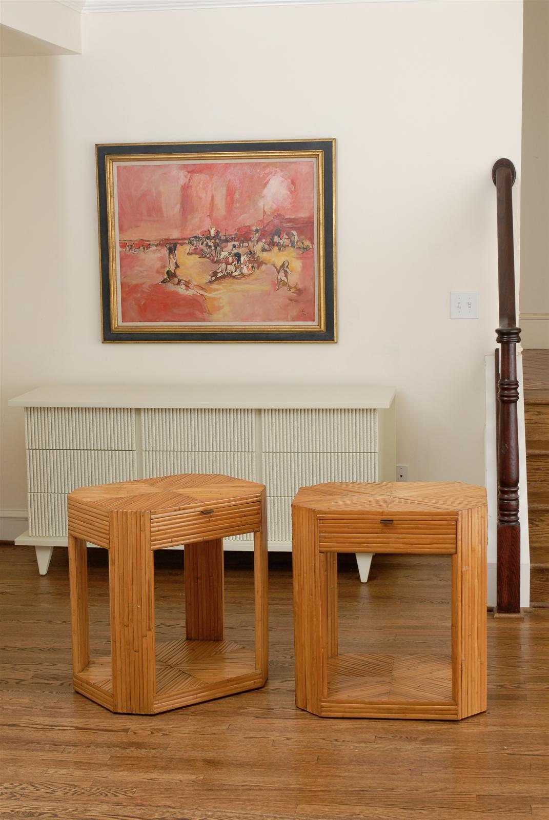 A stellar pair of vintage split bamboo end tables or nightstands. Individual bamboo pieces veneered over solid mahogany construction. Diagonally applied in sections at the tabletop and bottom creating a dramatic X effect. Absolutely beautiful