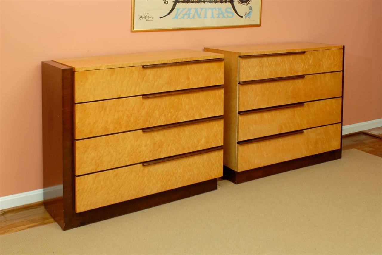 A Beautiful and Rare pair of chests ( model numbers 3626 and 3627 ) by Gilbert Rohde for Herman Miller, circa 1936-1940.  Birdseye Maple case construction with Walnut accents.  Highly functional pieces, the pair form a large credenza when aligned