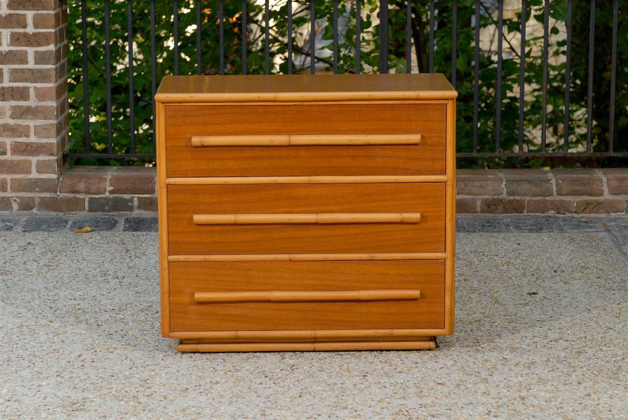 A beautiful and functional pair of restored vintage chests. Handsome mahogany case construction with fabulous bamboo accents. Rich and warm pieces which display exceptional quality and craftsmanship. While the chests are unmarked, they are