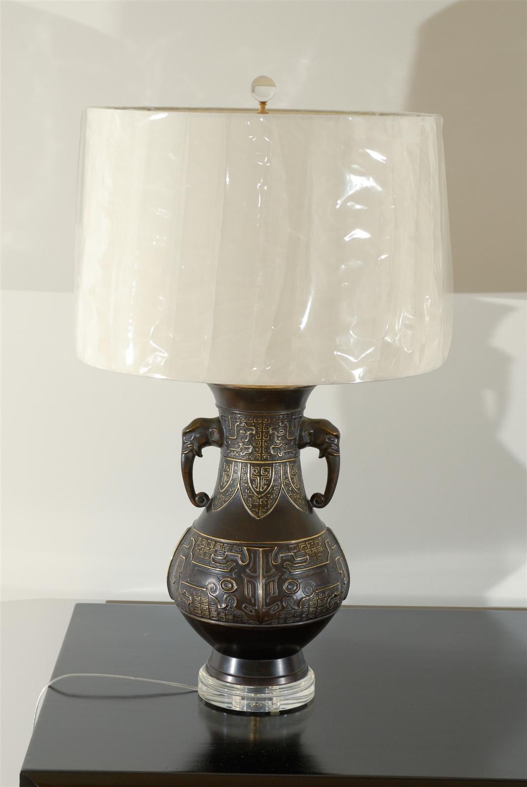 Unknown Exceptional Pair of Cast Urn Lamps with Elephant Head Detail For Sale