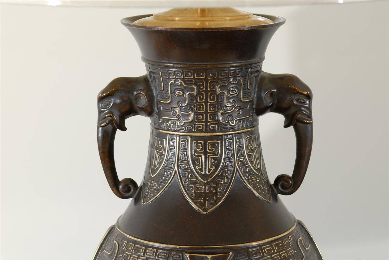 Exceptional Pair of Cast Urn Lamps with Elephant Head Detail For Sale 3
