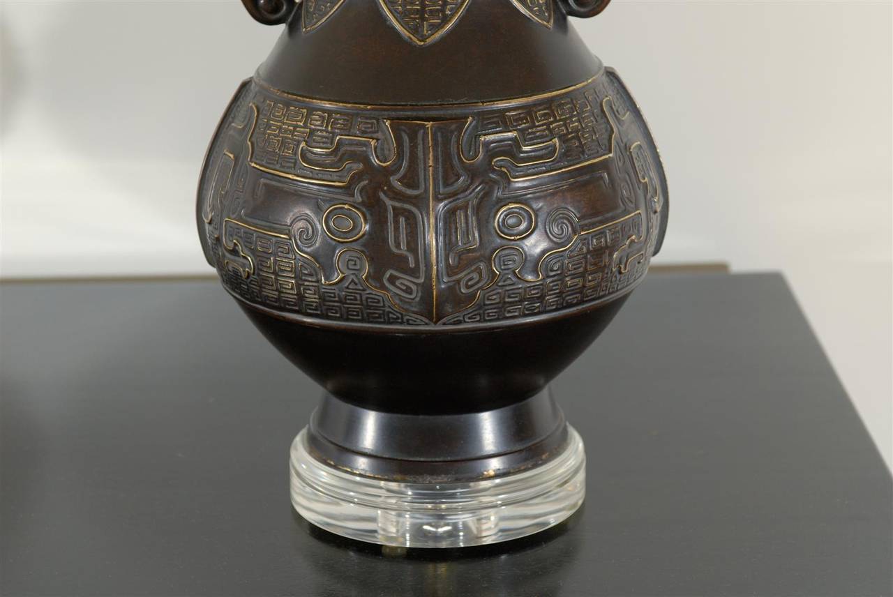 Exceptional Pair of Cast Urn Lamps with Elephant Head Detail In Excellent Condition For Sale In Atlanta, GA