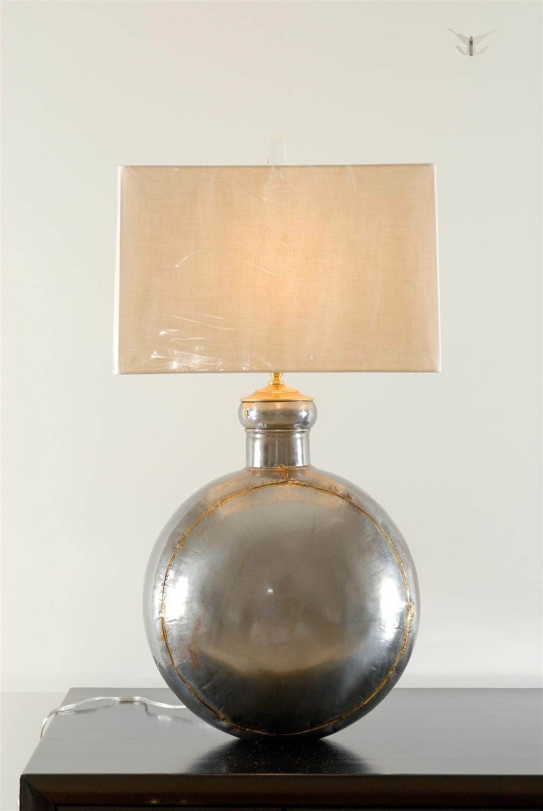 An exceptional pair of vintage hand forged lamps.  Beautiful nickel  Brutalist medallion form, seams soldered in brass with brass accents.  Fabulous jewelry for the room.  Imagine: Paul Evans meets Maison Jansen !  Excellent Restored Condition.  The