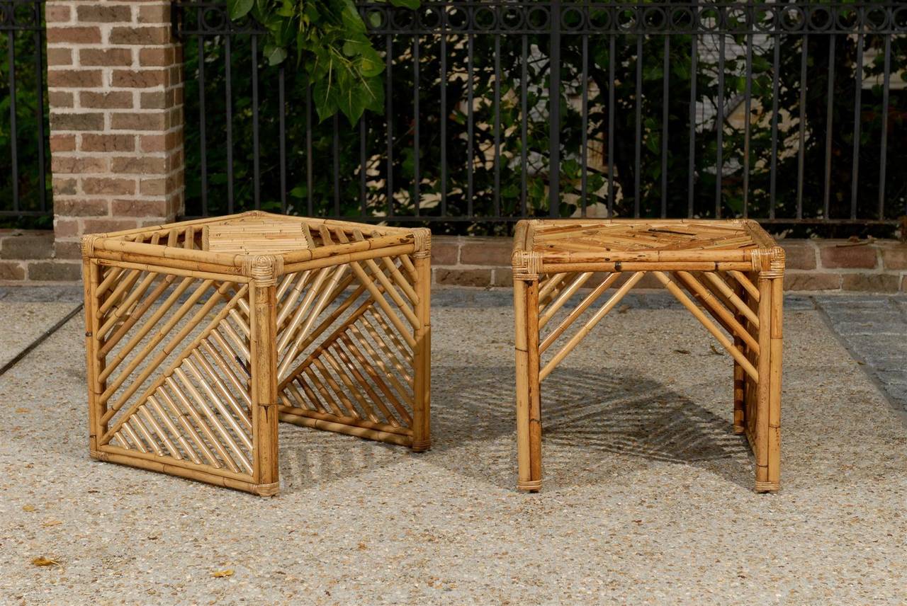 A dazzling pair of modern Chippendale style bamboo end tables or night stands, circa 1970s. Beautiful, graphic jewelry which displays fabulous warmth and texture. Stout and expertly made. Excellent Restored Condition, with wonderful patina. The