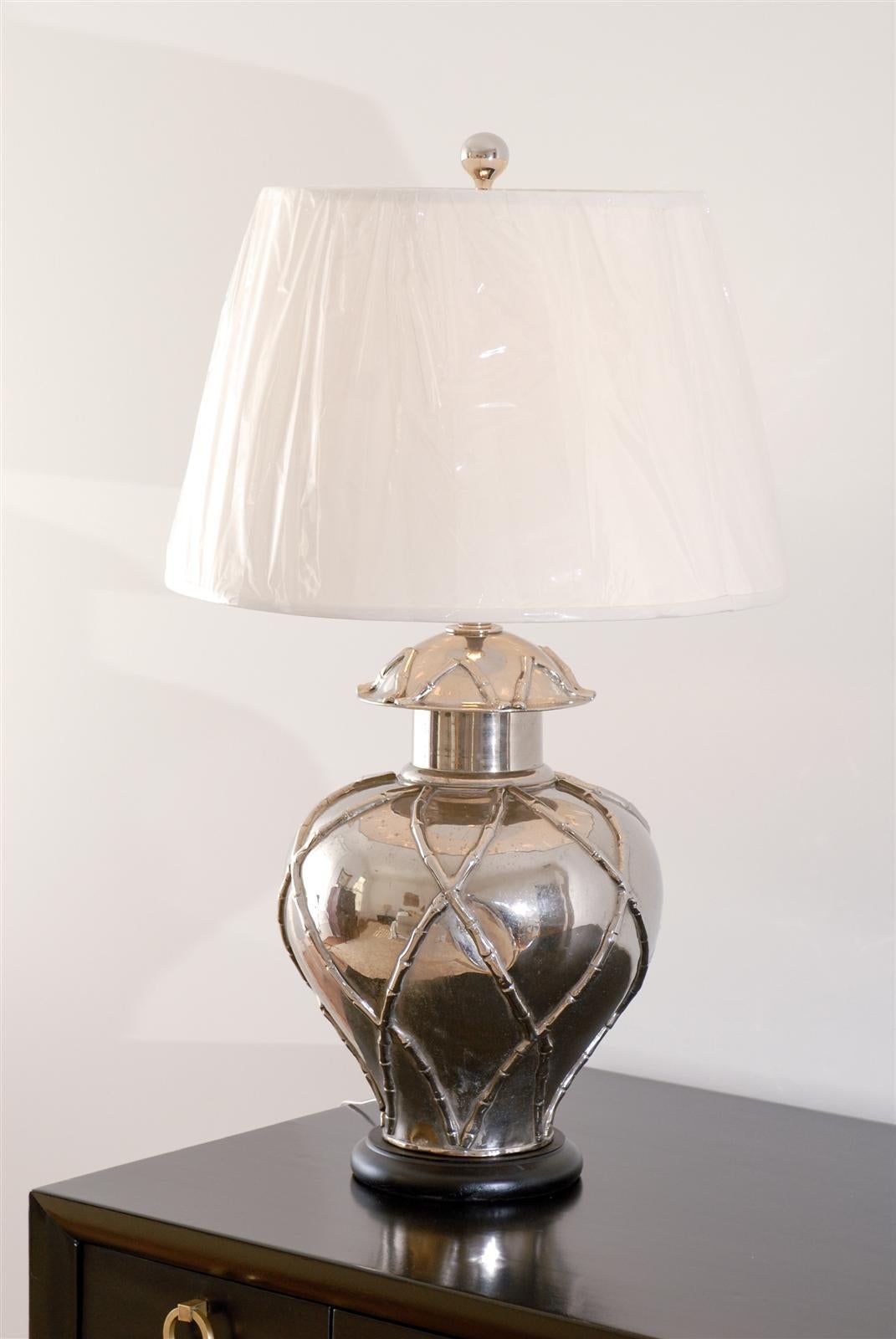 An outstanding pair of vintage ginger jar lamps with beautiful faux bamboo accents, circa 1970. Chrome plate over solid brass. Fine, expertly made pieces with excellent weight and scale. Breathtaking Jewelry! Excellent restored condition. The lamps