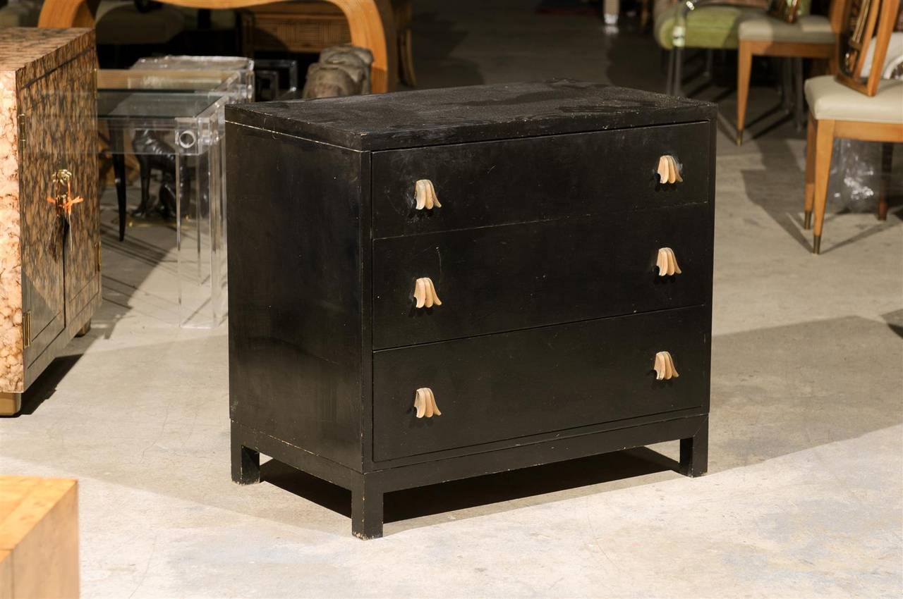 A beautiful three ( 3 ) drawer chest by Widdicomb, circa 1940s.  This unusual piece is highlighted by the seldom found Tulip style hardware coveted by Widdicomb enthusiasts.  To be restored in Client choice of lacquer color. Hardware to be re-plated