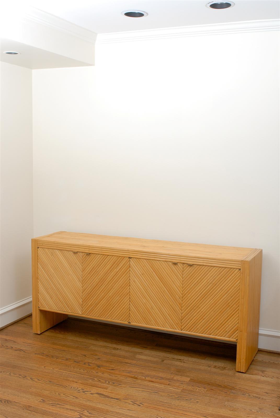 This magnificent chest is shipped as professionally photographed and described in the listing narrative: Completely Installation Ready.


A fabulous meticulously restored four-door cabinet, circa 1975. Expertly made split bamboo veneer over mahogany