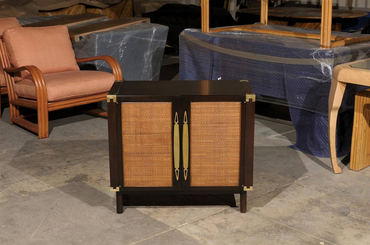 Mid-Century Modern Sophisticated Pair of Walnut Cabinets with Raffia and Brass Accents For Sale