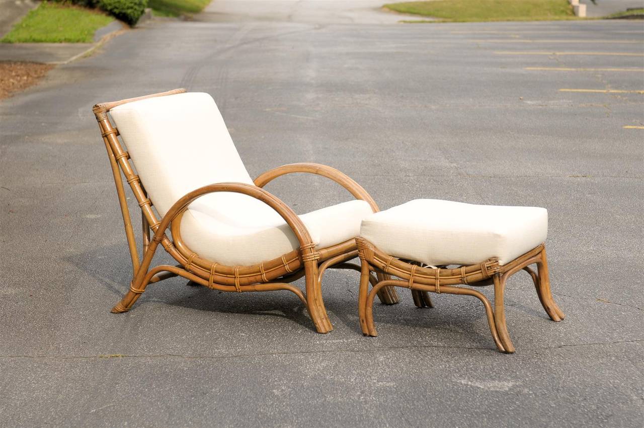 A stylish pair of vintage rattan lounge chairs with matching ottoman, circa 1970.  A beautifully designed set that offers wonderful comfort.  The unmistakable look of Old Money !  Excellent Restored Condition.  The pieces have been re-lacquered and