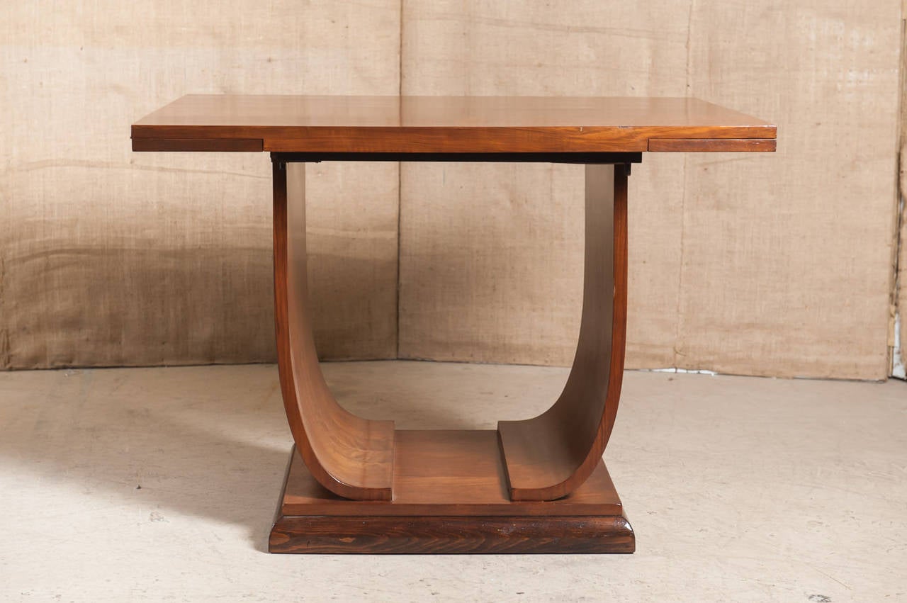 French Art Deco flip-top console table in walnut. Rectangular top sits above 