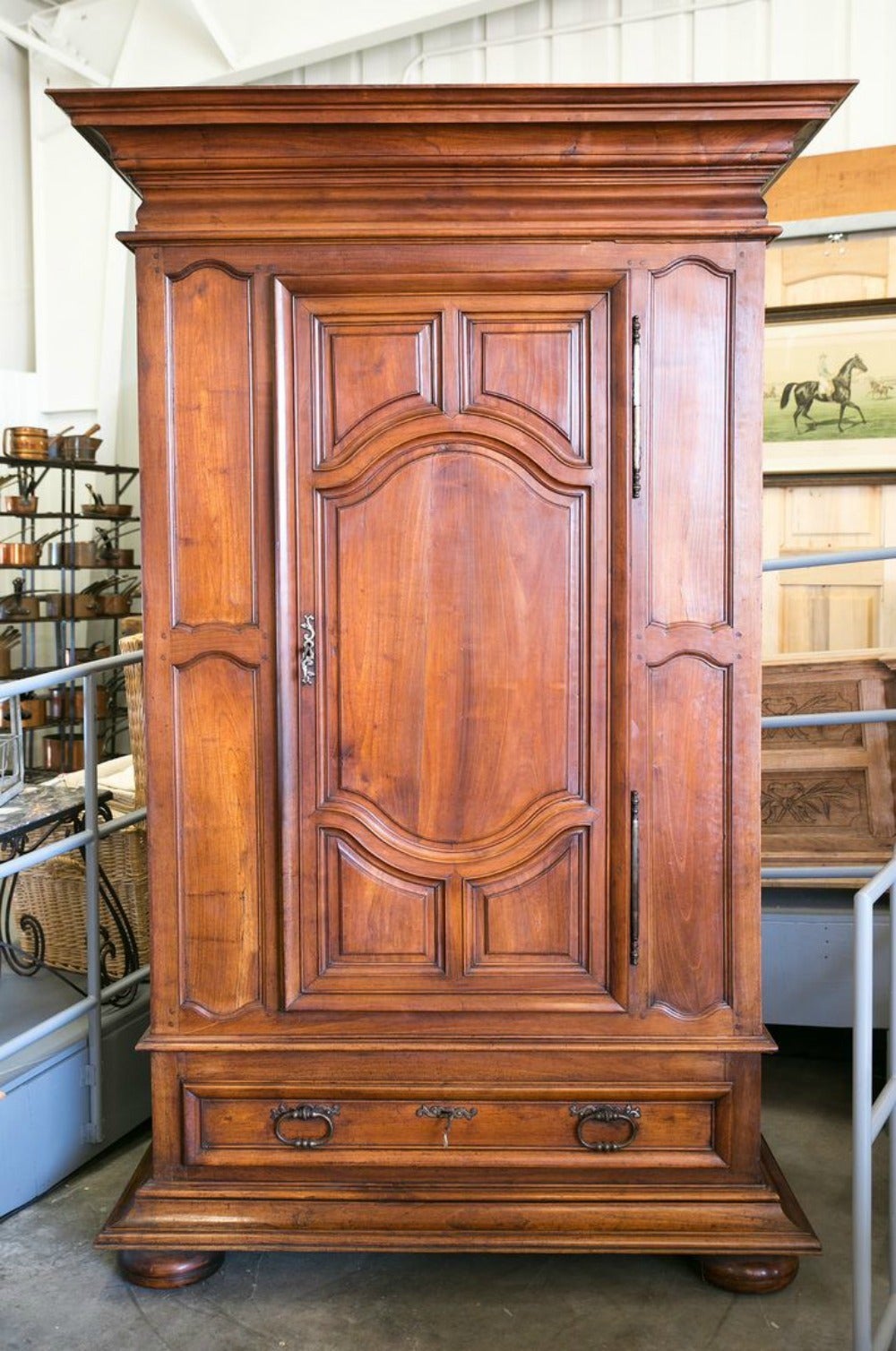 Rare and difficult to find Louis XIV period chateau bonnetiere. Solid walnut. An exceptional example from the Lyon region of France, renown in the 1700s for its superior production of armoires. Typical of Louis XIV ornamentation, the upper cabinet