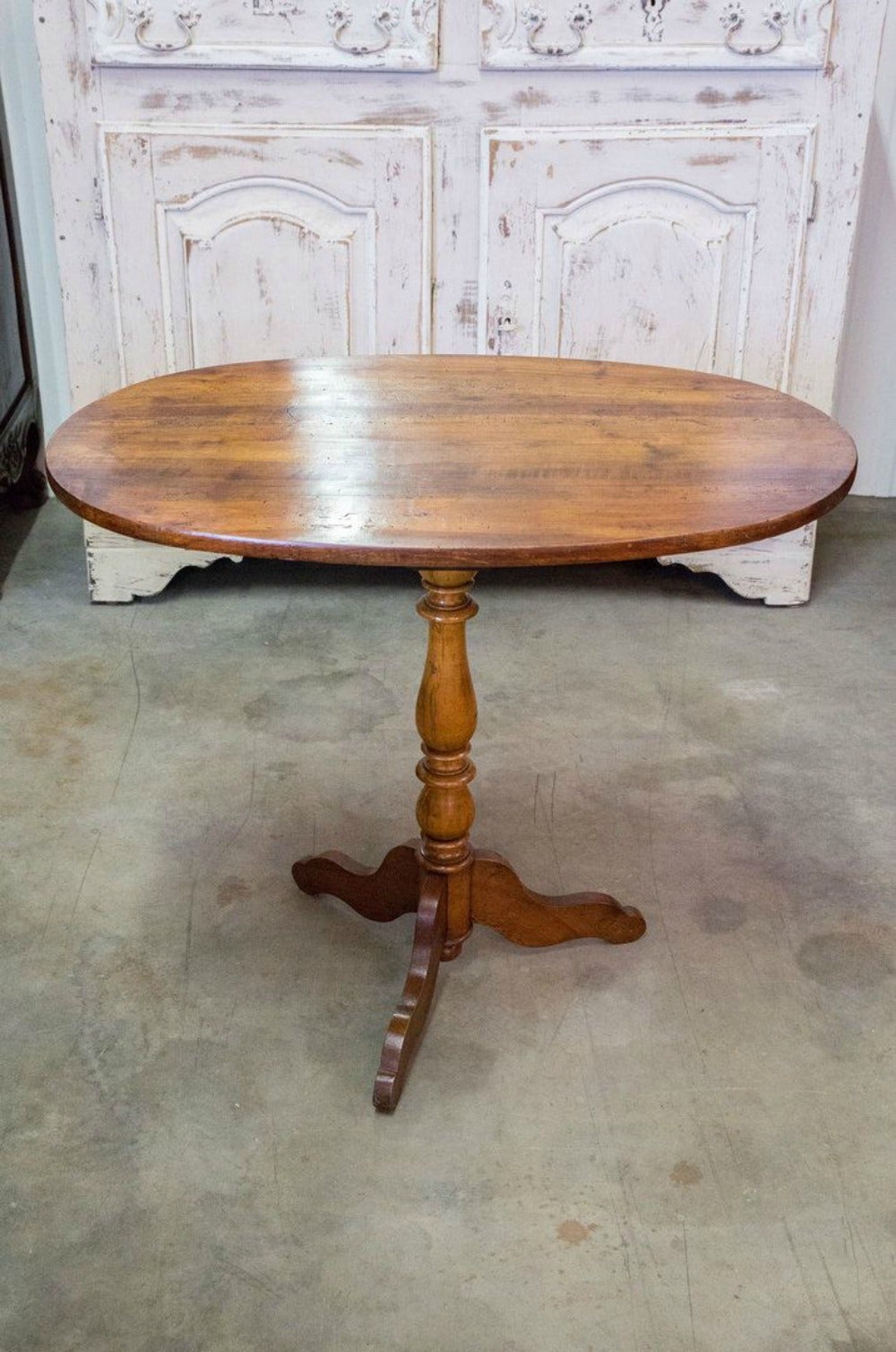 French Louis Philippe period gueridon from the Loire Valley. Solid cherrywood with a beautiful patina. The tripod pedestal has a turned baluster stem and serpentine legs.