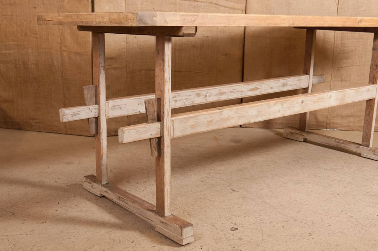 Antique French cheese table from the Normandy region of France. Wonderful aged pine patina. Cheese makers would work the cheese and then drain the whey into a wooden bucket that would sit below. Perfect for use as an island or work table.