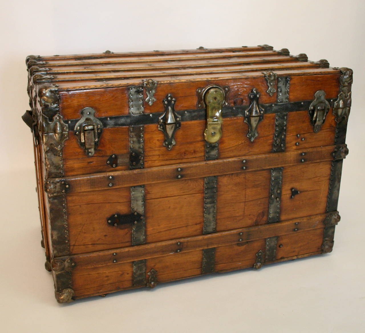 Large Antique Flat Top Trunk.  Circa mid-late 19th century.  Brass, pine and leather construction.  Trunk has been fully restored.