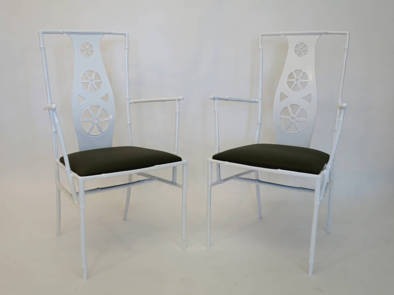 Pair of 'Montego' chairs by John Salterini. Powder coated aluminum with pinwheel backs and upholstered seats. Restored condition. Perfect for indoor and outdoor use, circa 1960s.