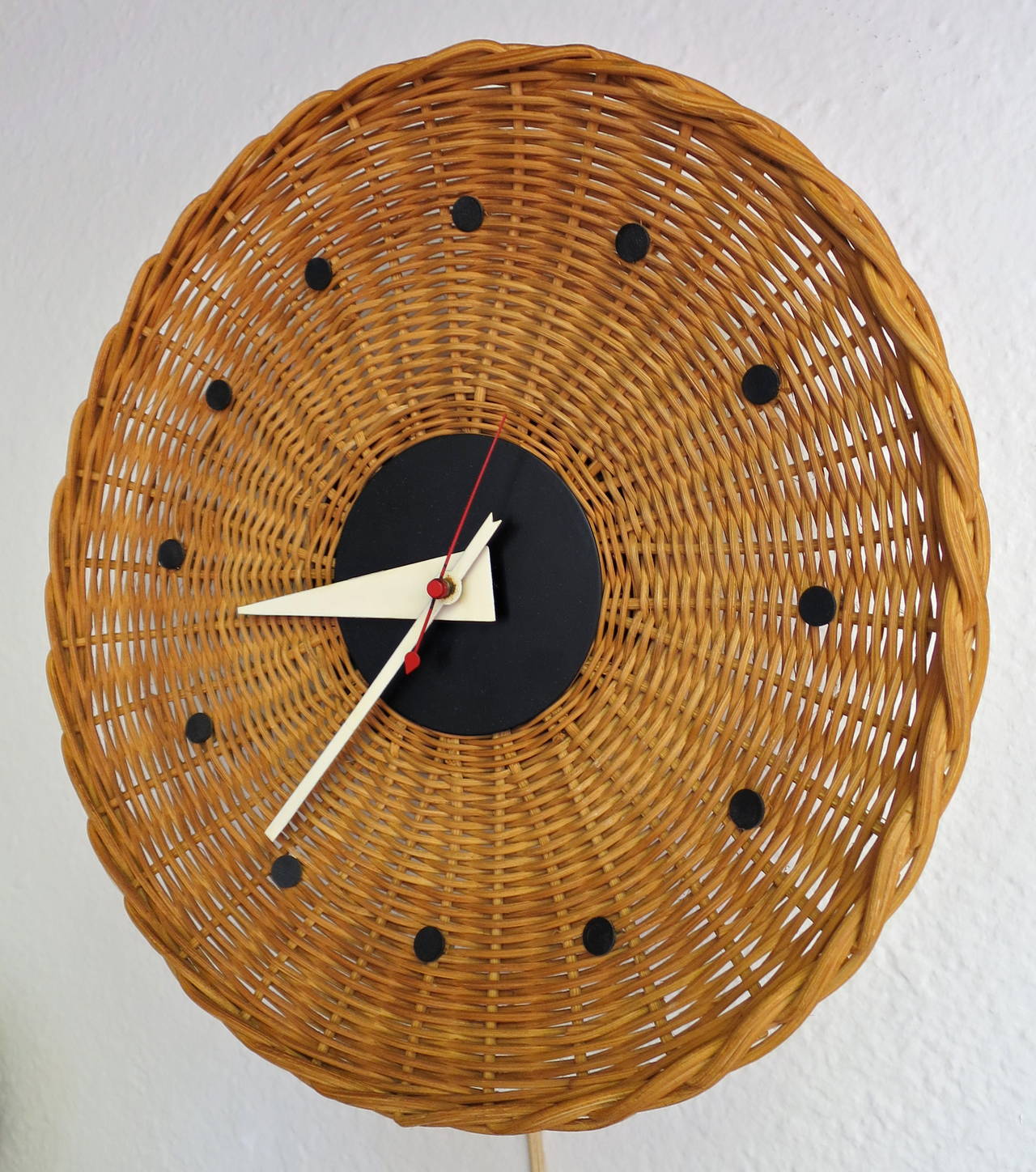 Mid-Century Round Basket Wall Clock.  Designed by George Nelson for Howard Miller.  Overall very nice original working condition.  Minor wear consistent with age/use.  Circa 1950's.