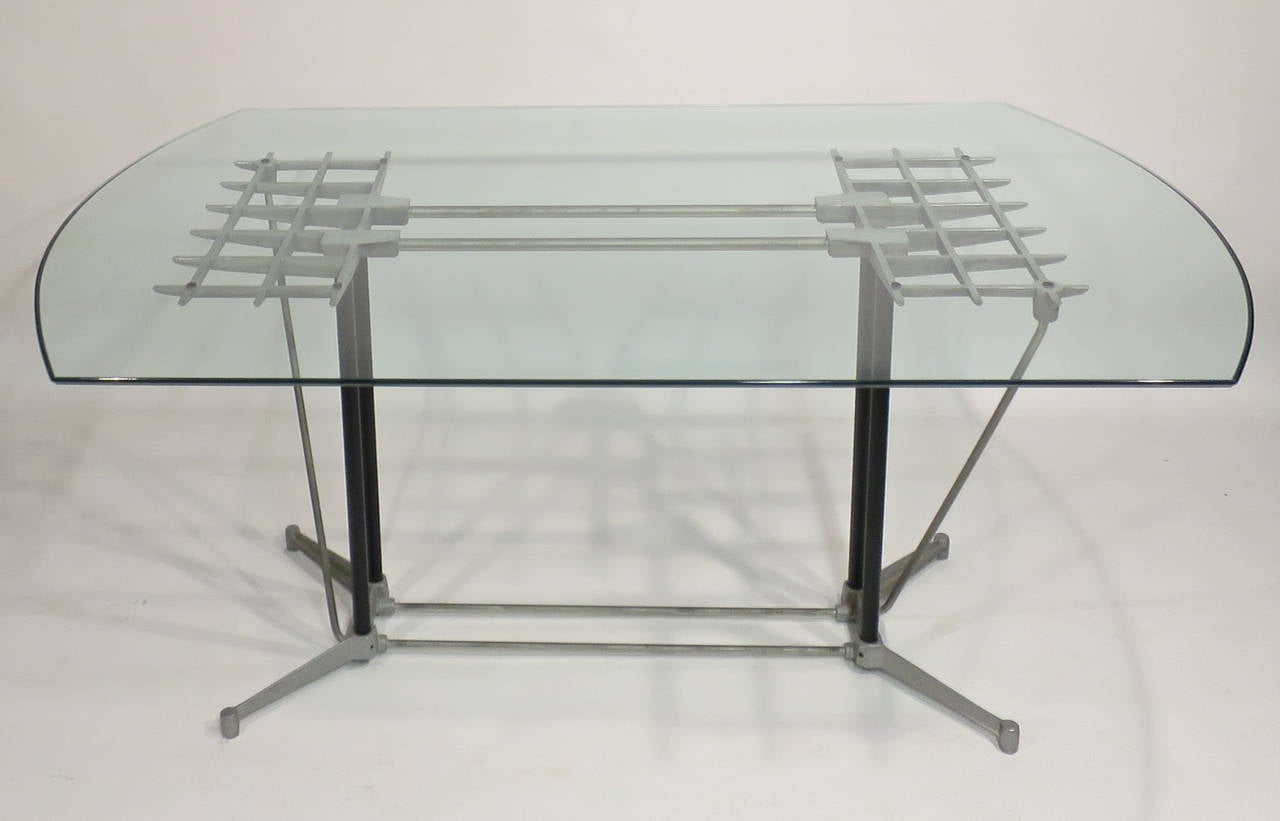 Aluminum 'Grid' table designed by Robert Josten. Base and polished edge glass top in very nice condition.
Measures: Glass 66