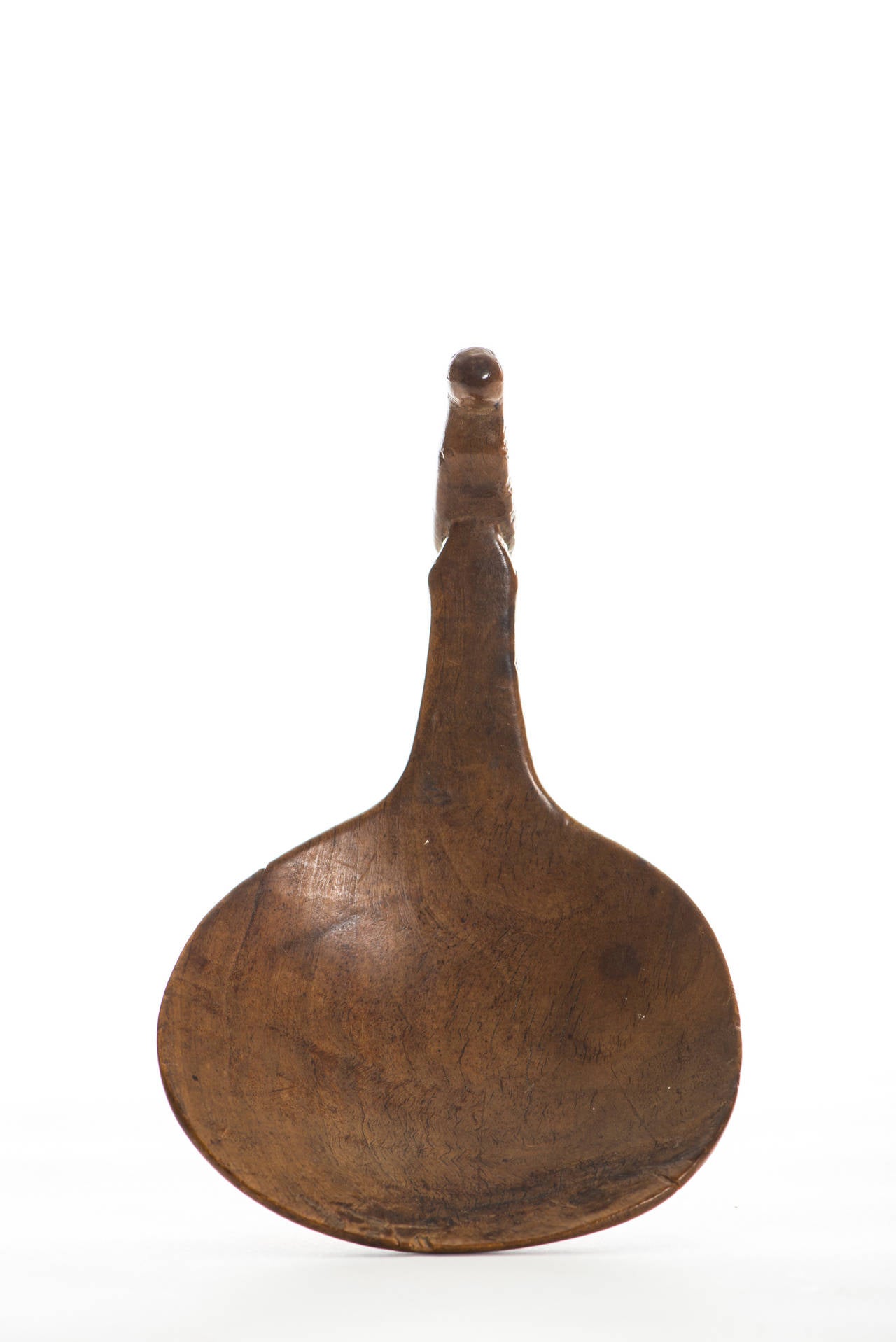 Bird Effigy Ladle.

Region/Tribe: Northeastern Woodlands/Iroquois,

circa mid-19th century.

Material: Maple.

Dimension: L. 7 3/4” x W. 5”.

Condition: Excellent, deep rich patina, no restoration.

Comments: This is a beautifully carved