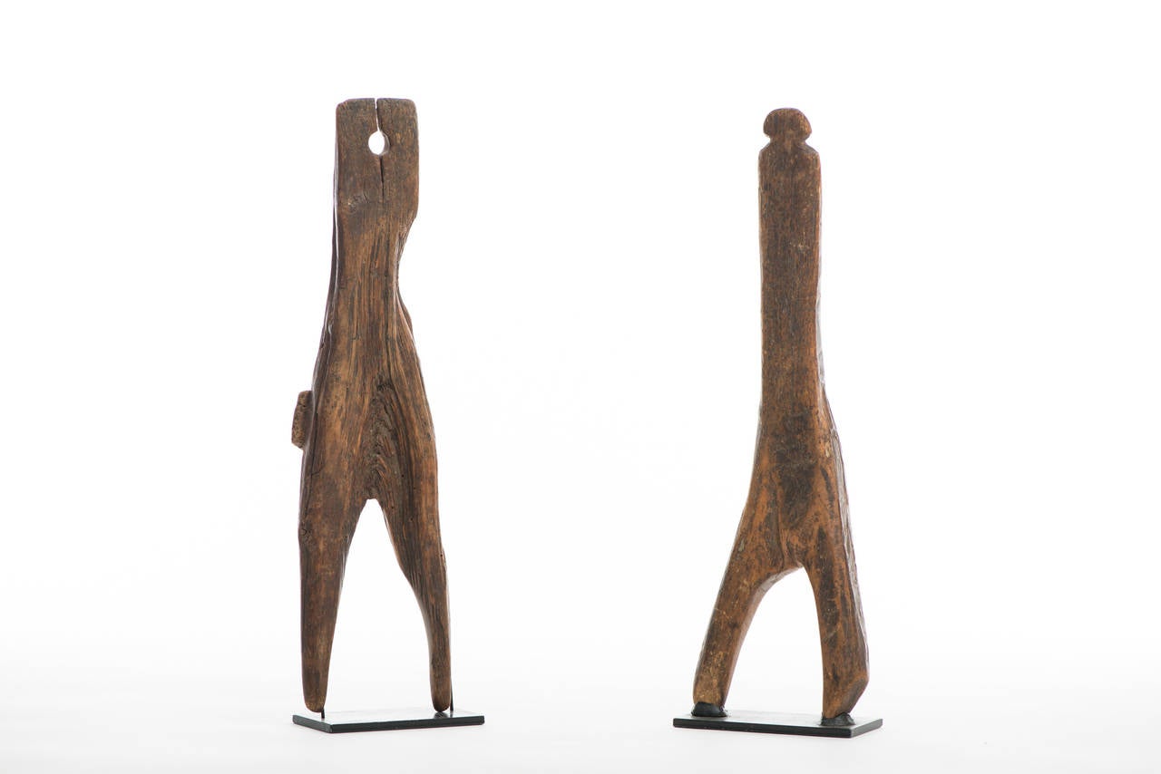 Figural primitive boot jacks.

Region: American, Northeast,

circa 18th century-early 19th century.

Material: Long grained hardwood

Dimension: 16 1/2” x 4 1/2” (left).
 16 1/4” x 4 3/4” (right).

Condition: Excellent, heavily worn.