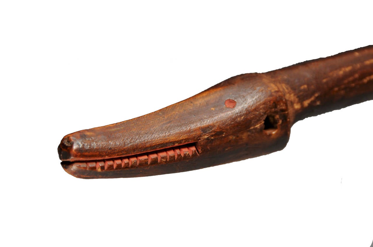 Animal Effigy Club.

Region/tribe: Southeastern Woodlands/a tentative attribution made to the creek,

circa early mid-19th century.

Material: Wood, red pigments, steel blade.

Condition: Excellent, deep rich patina, no