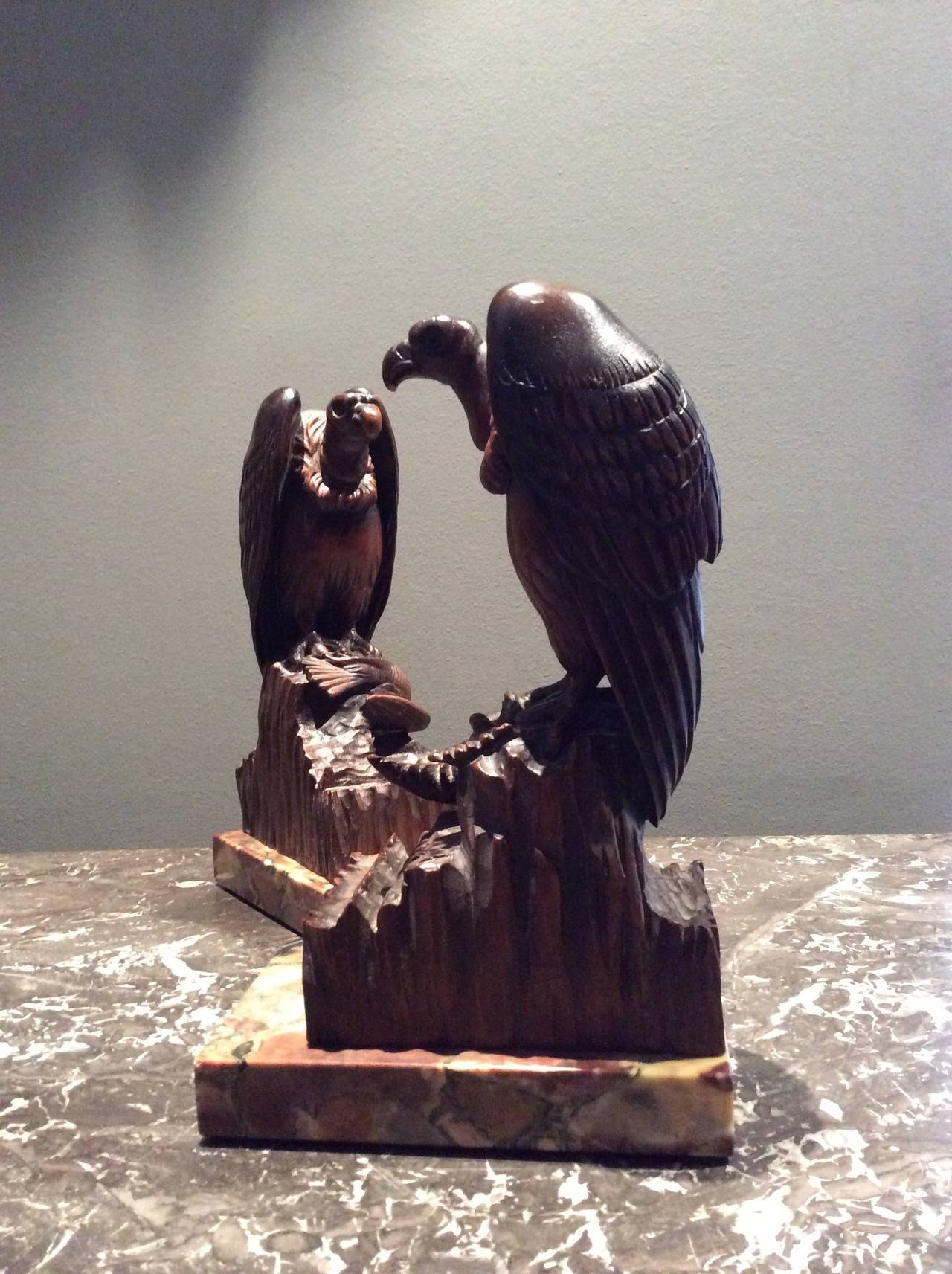 Exceptional pair of intricately carved wooden sculptures representing a hawk sitting on a rock holding in its claws a prey.
1930 Art Deco era bears a signature. J. Betola.
Directly inspired by the sculptures of Paul Jouve. Notice to lovers of Art