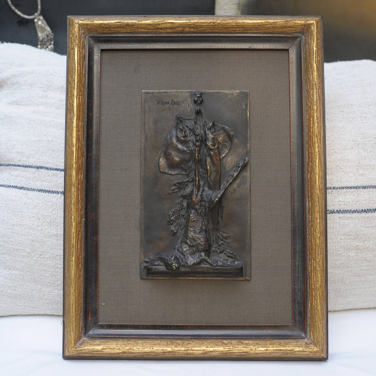 Patinated bronze plaque by famed artist P.J. Mêne depicting a hare and game fish. Translated French title is 